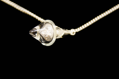 Encased Heart glass piece on a Sterling silver chain. Side Angle. Irish and Celtic Cremation Memorial Jewelry